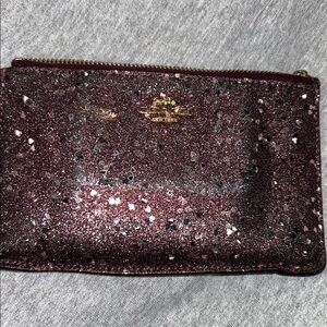 COACH Heart Glitter Small Wristlet in Raspberry Sparkling.